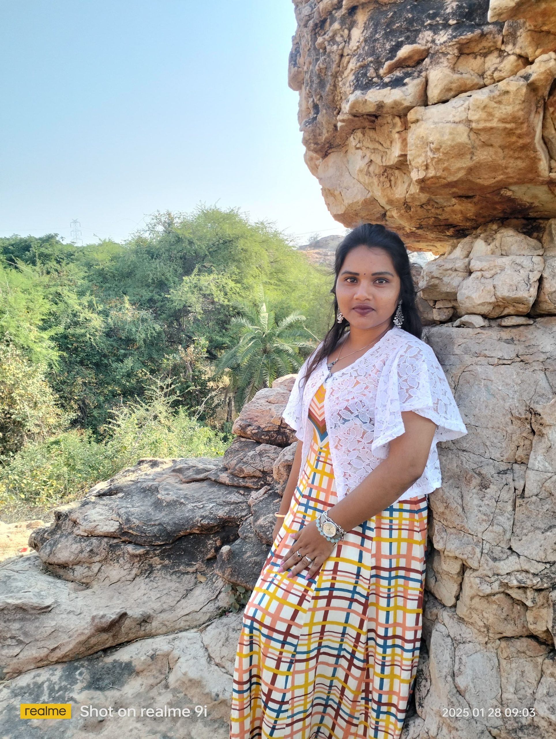 A person leaning against a rock AI-generated content may be incorrect
